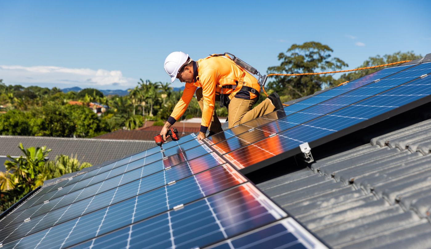Close-up of solar panels on an aging roof before removal begins