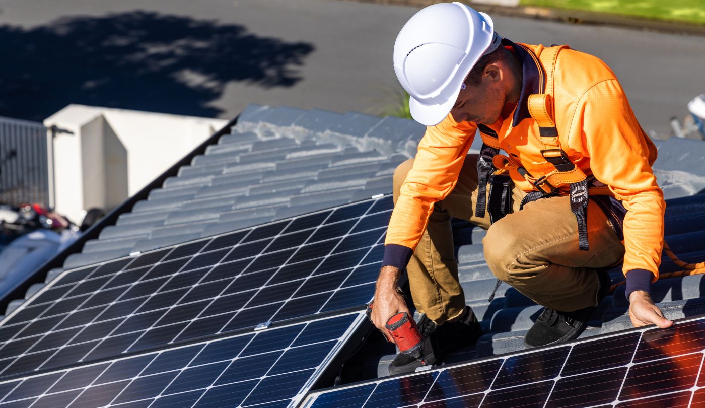Technician removing solar panel on the homeowners roof